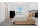 Cozy bedroom with neutral tones, comfortable bed, and a view from the window at 18953 E 97Th Ave, Commerce City, CO 80022