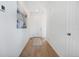 Well-lit hallway with light wood floors and clean, neutral walls and decor at 18953 E 97Th Ave, Commerce City, CO 80022