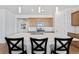 Stylish kitchen featuring a large center island with quartz countertop and modern pendant lighting at 18953 E 97Th Ave, Commerce City, CO 80022