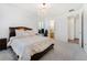 Serene main bedroom suite with soft lighting and a view to a study or workspace at 18953 E 97Th Ave, Commerce City, CO 80022