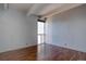 Empty bedroom area with hardwood floors and bright lighting at 777 Washington N St # 802, Denver, CO 80203