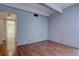 The spacious bedroom has wood floors and is painted in a neutral color at 777 Washington N St # 802, Denver, CO 80203