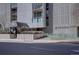 A welcoming entrance to a building featuring a covered walkway and manicured landscaping at 777 N Washington St # 802, Denver, CO 80203