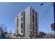 Striking building exterior featuring a modern design with balconies against a bright blue sky backdrop at 777 N Washington St # 802, Denver, CO 80203