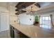 Open kitchen design featuring stainless steel appliances, an island, and a clear view of the living space at 777 N Washington St # 802, Denver, CO 80203