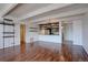 Large living room with hardwood floors and a partial view of the kitchen at 777 N Washington St # 802, Denver, CO 80203