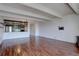 Spacious living room with hardwood floors and a partial view of the kitchen at 777 Washington N St # 802, Denver, CO 80203