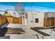 Cozy backyard area features a wooden fence, small storage building and a convenient concrete pad at 1825 W 32Nd Ave, Denver, CO 80211