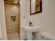 Updated bathroom featuring a tiled shower with decorative niche at 1825 W 32Nd Ave, Denver, CO 80211