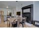 Cozy dining room featuring a fireplace, hardwood floors, and modern decor at 1825 W 32Nd Ave, Denver, CO 80211