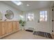 Cozy entry way with wood floors, built in cabinets and a view to the outside at 1825 W 32Nd Ave, Denver, CO 80211