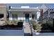 Charming two-story home with a landscaped front yard and black and white color scheme at 1825 W 32Nd Ave, Denver, CO 80211