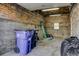 Unfinished garage with concrete floor, brick walls, and a small window, perfect for storage or a workshop at 1825 W 32Nd Ave, Denver, CO 80211