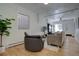 Bright living room with wood floors, a textured wall and furniture at 1825 W 32Nd Ave, Denver, CO 80211