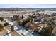 An aerial view of a residential neighborhood in winter showcasing various architectural home styles at 9140 E 29Th Ave, Denver, CO 80238