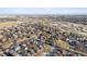 A bird's-eye view of a suburban community with colorful homes surrounded by open spaces and convenient road access at 9140 E 29Th Ave, Denver, CO 80238