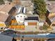 Aerial view of a house with solar panels, fenced backyard, and garage, showcasing sustainable living and outdoor amenities at 9140 E 29Th Ave, Denver, CO 80238