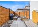 Fenced backyard featuring a barbecue grill and raised garden beds, perfect for outdoor cooking and gardening at 9140 E 29Th Ave, Denver, CO 80238