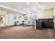 A finished basement with bar area, comfortable seating, and rec space at 9140 E 29Th Ave, Denver, CO 80238