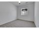 Neutral bedroom featuring a window and light grey carpet at 4040 Eaton Park St, Aurora, CO 80019
