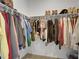 Walk-in closet featuring ample hanging space and shelving for shoe storage at 4040 Eaton Park St, Aurora, CO 80019