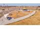 Community park featuring a carousel, swings, and covered picnic area at 4040 Eaton Park St, Aurora, CO 80019