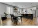 Dining area showcasing lots of natural light, an island kitchen, and an open floor plan at 4040 Eaton Park St, Aurora, CO 80019
