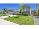 Lovely home with green lawn and landscaping; a view of the front and side of the house at 4040 Eaton Park St, Aurora, CO 80019