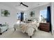 Bright main bedroom with windows, furnishings, and decor at 4040 Eaton Park St, Aurora, CO 80019