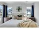 Bright main bedroom with windows and stylish decor at 4040 Eaton Park St, Aurora, CO 80019