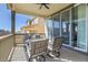 Relaxing covered patio with comfortable seating and ceiling fan overlooking the neighborhood at 4040 Eaton Park St, Aurora, CO 80019