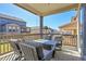 Relaxing covered patio featuring comfortable seating and neighborhood views at 4040 Eaton Park St, Aurora, CO 80019
