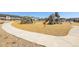 Community playground with multiple play structures and wood chip ground cover at 4040 Eaton Park St, Aurora, CO 80019