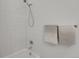 Bright bathroom shower featuring white tile at 4040 Eaton Park St, Aurora, CO 80019