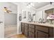Bathroom featuring double vanity with granite counters and modern fixtures at 3188 Lynwood Ave, Highlands Ranch, CO 80126