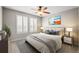 Bright bedroom with white plantation shutters, neutral decor and natural lighting at 3188 Lynwood Ave, Highlands Ranch, CO 80126