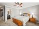 Cozy bedroom with ceiling fan and en-suite bathroom is the perfect retreat at 3188 Lynwood Ave, Highlands Ranch, CO 80126