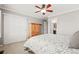This bedroom boasts a large wardrobe, an attached bath, and a bright window at 3188 Lynwood Ave, Highlands Ranch, CO 80126