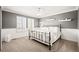 Bright bedroom with ceiling fan, natural light, and neutral color palette at 3188 Lynwood Ave, Highlands Ranch, CO 80126