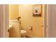 Small half bathroom with a pedestal sink and toilet at 6424 Silver Mesa Dr # C, Highlands Ranch, CO 80130