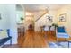 Bright dining area with hardwood floors and a charming light fixture at 6424 Silver Mesa Dr # C, Highlands Ranch, CO 80130