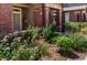 Brick building exterior with well-manicured landscaping and walkway at 6424 Silver Mesa Dr # C, Highlands Ranch, CO 80130