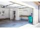 Garage with workbench and extra storage at 6424 Silver Mesa Dr # C, Highlands Ranch, CO 80130