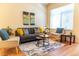 Cozy living room featuring hardwood floors, comfortable seating, and a neutral color palette at 6424 Silver Mesa Dr # C, Highlands Ranch, CO 80130