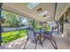 Inviting covered back patio with skylights, perfect for outdoor dining and relaxation in a serene backyard setting at 1977 S Urban St, Lakewood, CO 80228