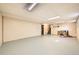 This spacious basement area features neutral paint and includes unfinished and finished sections at 1977 S Urban St, Lakewood, CO 80228