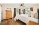 Bright bedroom with hardwood floors, natural light, and a ceiling fan at 1977 S Urban St, Lakewood, CO 80228