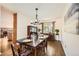 Cozy dining room with elegant lighting, hardwood floors, and stylish furniture at 1977 S Urban St, Lakewood, CO 80228