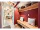 Hallway with mudroom bench and ample storage leading into the living area at 1977 S Urban St, Lakewood, CO 80228
