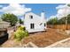 A cozy backyard with a deck, a white house, and a flamingo in the background at 11376 Forest Dr, Thornton, CO 80233